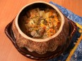 Pots with fish and potatoes